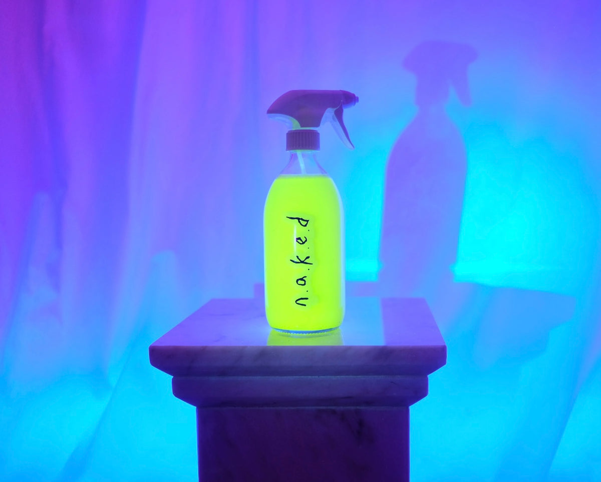 n.a.k.e.d 500ml glass spray bottle on bright background